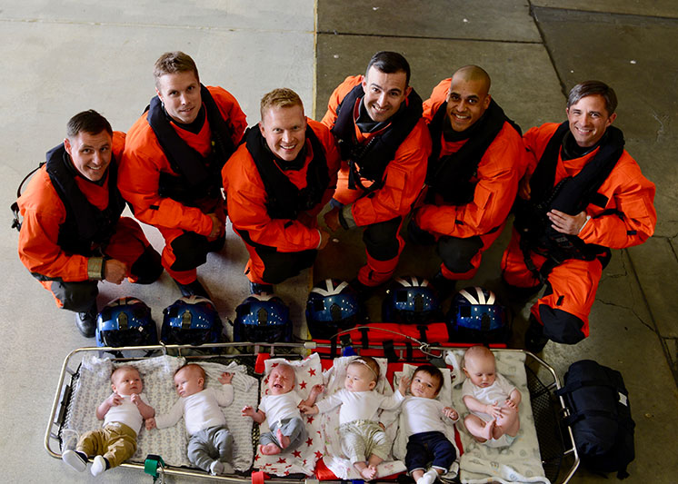 A group of airmen with their babies. Links to Gifts That Protect Your Assets